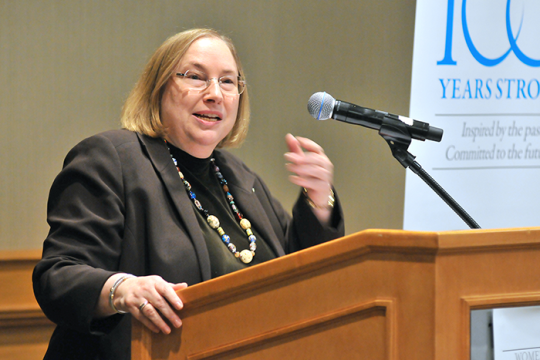 Rabbi Marla J. Feldman, Executive Director, Women of Reform Judaism speaking at a podium with a microphone