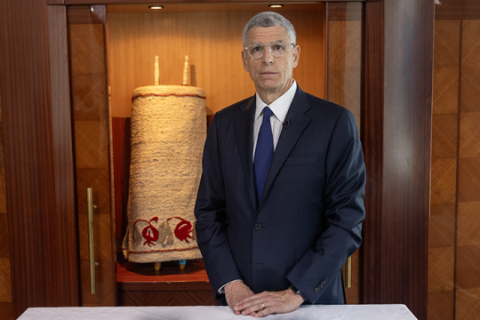 Rabbi Rick Jacobs standing in front of an open ark