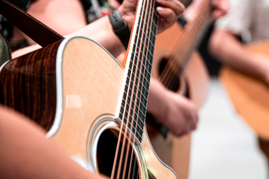 people playing guitar